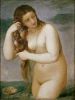 Reproduction of Venus Anadyomene by Titian. Woman with long hair sitting in water beside a shell.