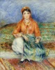 Reproduction of Algerian Girl by Renoir - A woman in colorful attire sits against a patterned carpet backdrop.