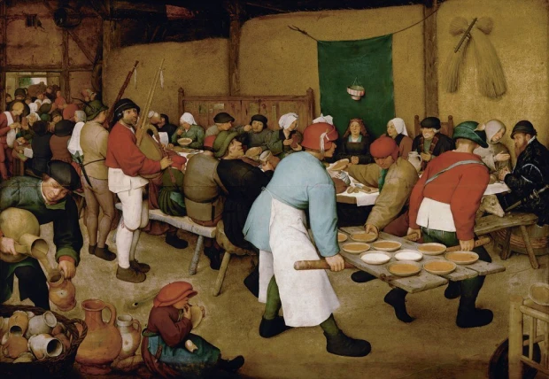 Reproduction of The Peasant Wedding by Pieter Bruegel - Decor in a rustic cottage with beige walls and wooden furniture.