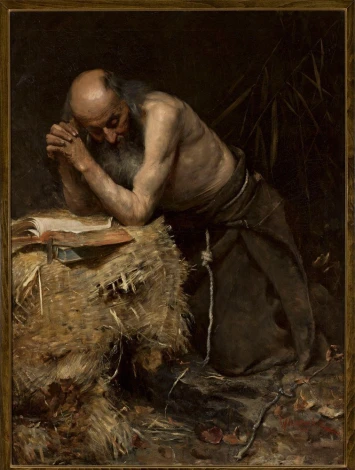 Reproduction of The Anchorite by Teodor Axentowicz. A man kneels by a haystack with a book in front of him.
