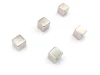 Set of 5 neodymium magnets in various sizes - graphic design. Five cubic magnets in metallic color.