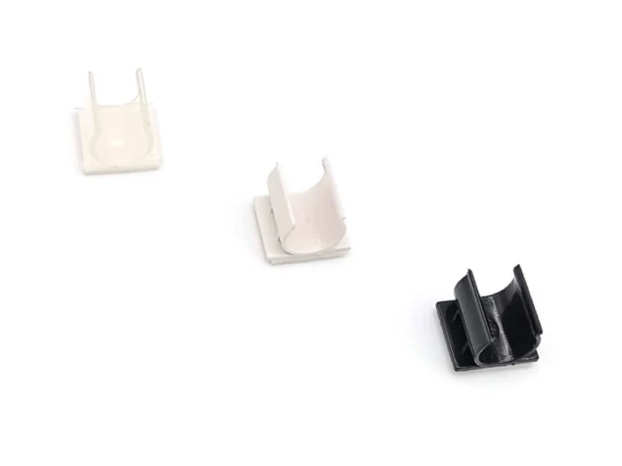 Plastic holder for double-sided markers or pens - Graphic design. Three holders in white and black colors.
