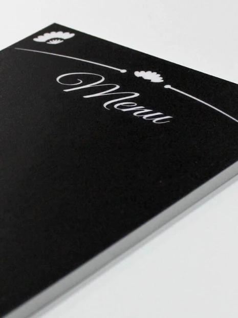 Chalkboard menu sign 022 - Black background with white "Menu" text and subtle ornaments.