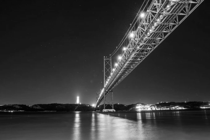 Wall mural of a lit bridge against a navy blue sky FP 3106 - Graphic design. Bridge illuminated at night.