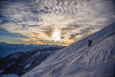 Winter wall mural of a lone traveler on a snowy mountain slope, graphic design FP 3140.
