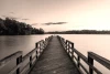 Wall mural of a lakeside pier FP 3178 - Living room decor. Wooden pier leads to the lake, surrounded by nature.