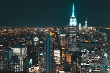 Wall mural of New York City at night FP 3182 - Graphic design featuring bright skyscrapers and illuminated streets.