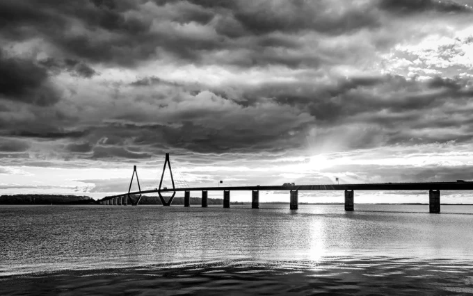 Wall mural of a bridge over a lake FP 3413 - Graphic design in monochrome tones with clouds.