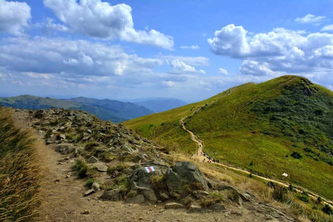 Wall mural Bieszczady paths FP 3459 - Graphic design featuring a mountain landscape with green hills.