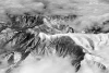 Winter mountain range wall mural FP 3484 - Graphic design featuring snow-covered peaks in the clouds.