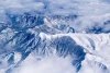 Winter mountain range wallpaper FP 3484 - Graphic design featuring snow-covered peaks surrounded by clouds.