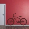 Stylish bike sticker 013 in a modern interior, perfect for brightening up a red wall in a youth room.
