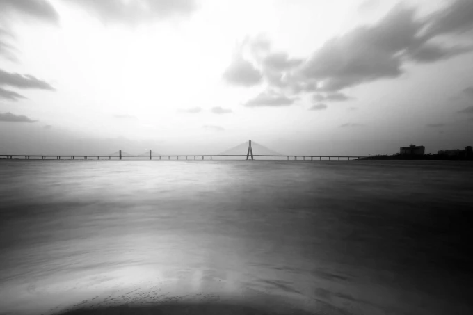 Wall mural of a bridge against a purple sunset FP 3597 - Graphic design. Sleek bridge silhouette in the background.