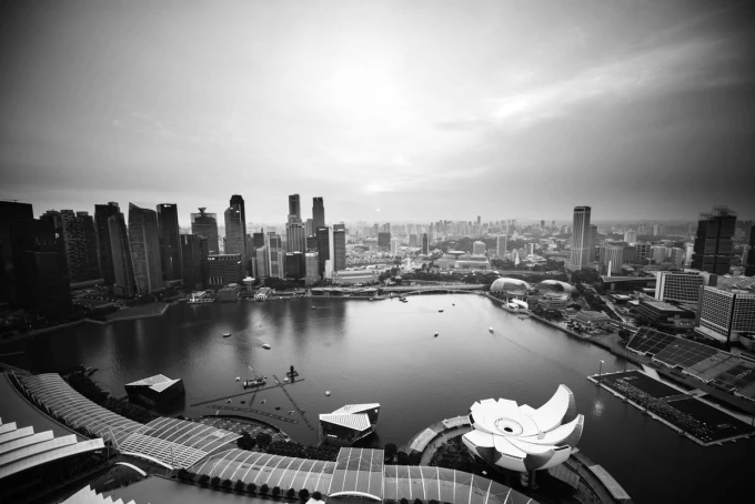 Wall mural of a sunset in a big city FP 3765 - Graphic design. View of skyscrapers and water.