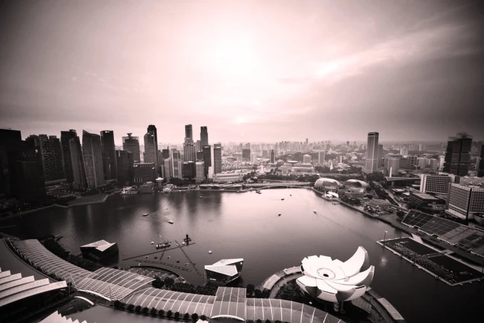Wall mural of a sunset in a big city FP 3765 - Graphic pattern. City view with water and buildings in the background.