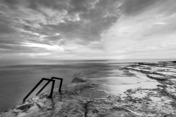 Wall mural of an extraordinary island FP 3787 - Graphic design featuring a rocky island with metal stairs.