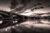 Wall mural Parisian night FP 3860 - Graphic design. Bridge over a river in monochrome tones with clouds.