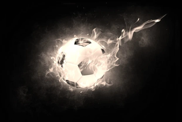 Wall mural of a soccer ball in flames FP 4034 - Graphic design with a ball surrounded by flames on a dark background.