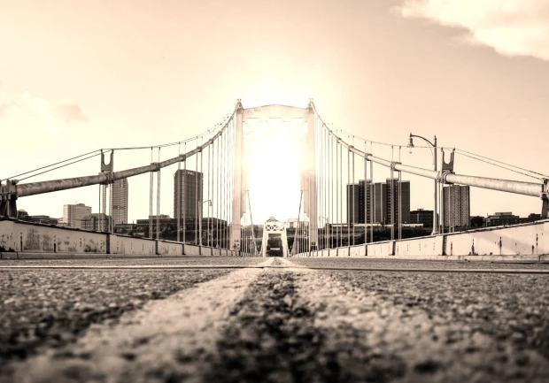 Golden Gate wall mural FP 4131 - Graphic design featuring a golden-lit bridge with a city view in the background.