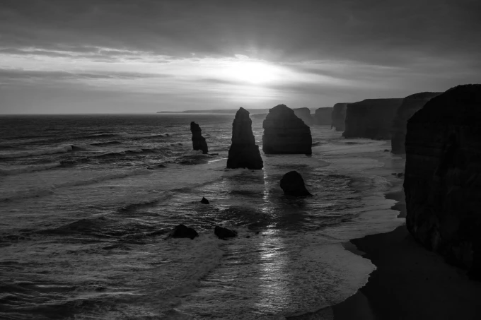 Summer sunset wall mural FP 4196 - Graphic design featuring rocks in the sea and a setting sun.