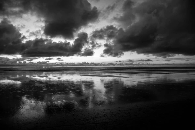 Wall mural of a cloudy sunset FP 4309 - Graphic design featuring dark clouds over water with reflection.