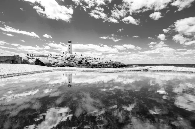 Wall mural of a lighthouse reflected in water FP 4439 - Designed for natural space. Lighthouse visible against the sky.