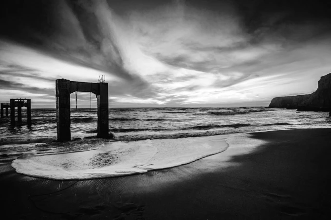Wall mural of bridge remnants on the island FP 4424 - Graphic design. Black and white image depicting a fragment.