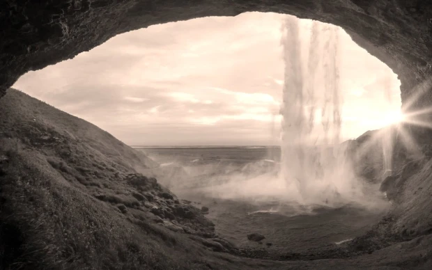 Wall mural of a turbulent waterfall FP 4432 - Graphic design. Water cascades down surrounded by rocks and mist.