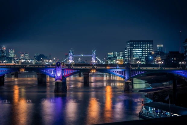 Wall mural of a bridge illuminated by colorful lights FP 4618 - Graphic design. The bridge reflects colorful lights.