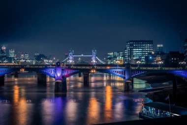 Wall mural of a bridge illuminated by colorful lights FP 4618 - Graphic design. The bridge reflects colorful lights.