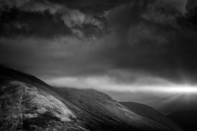 Sunset wall mural FP 4608 - Graphic design. Dark hills with a beam of light in the background.
