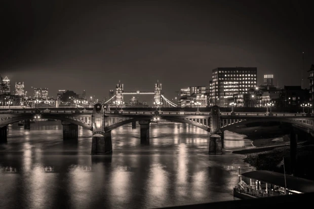 Wall mural of a bridge illuminated by colorful lights FP 4618 - Graphic design. Nighttime bridge with reflections.