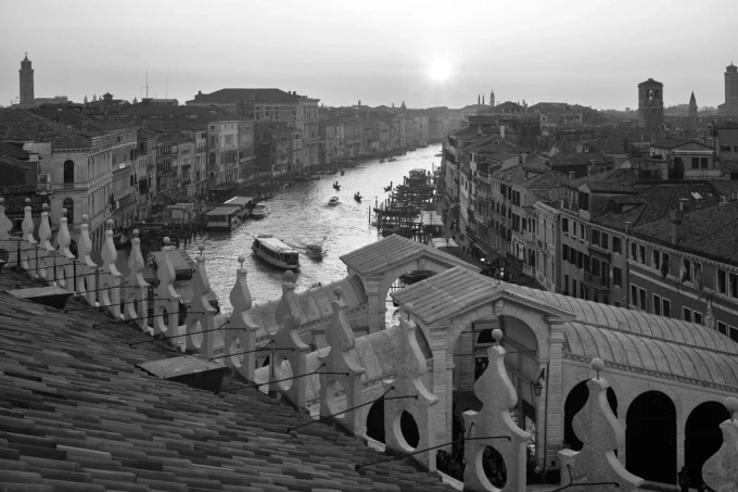 Wall mural of a sunset in Venice FP 4663 - Graphic design. View of the canal with boats and buildings in the background.