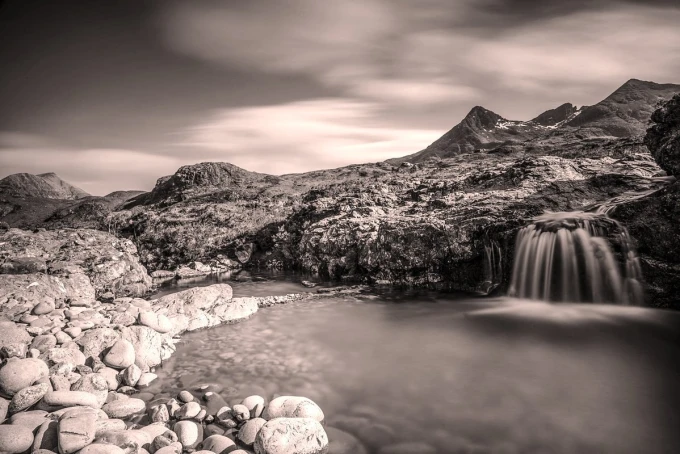 Blue water in a bay wall mural FP 5096 - Graphic design featuring water, rocks, and mountains in monochrome shades.