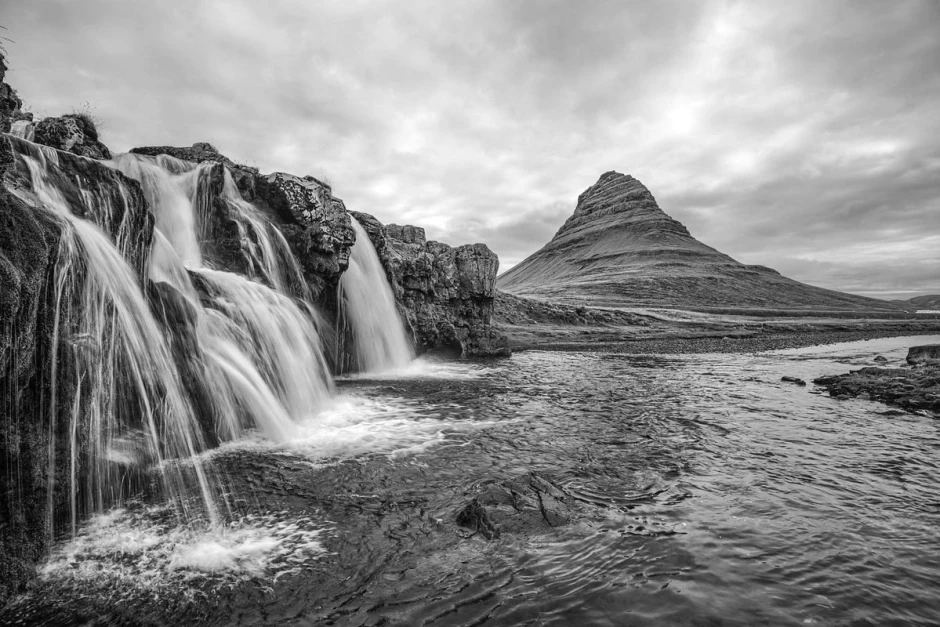 Waterfall cascade wall mural FP 5098 - Graphic design. Water flows over stones with mountains in the clouds in the background.