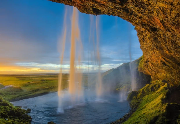 Waterfall canyon wall mural FP 5105 - Graphic design. Water cascades from a high rock, surrounded by green hills.
