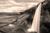 Rocky waterfall wall mural FP 5154 - Graphic design. Water cascades from a tall rock in a mountainous setting.