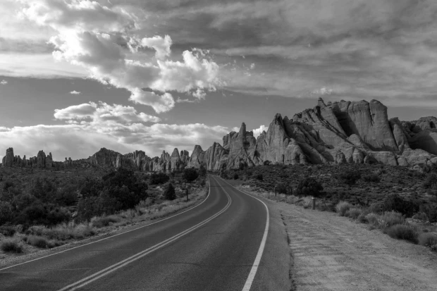 Wall mural of a road through the Grand Canyon FP 5315 - Graphic design. The road winds through rocky formations.
