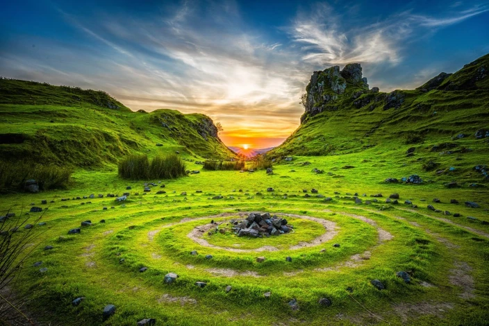 Green meadow wall mural FP 5345 - Graphic design featuring stone circles in green grass under a setting sun.