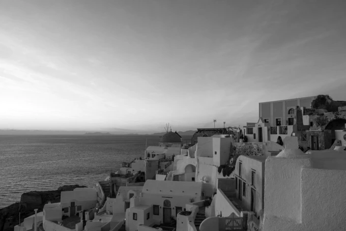 Wall mural of a windmill in Santorini FP 5415 - Graphic design featuring white buildings and sea in the background.