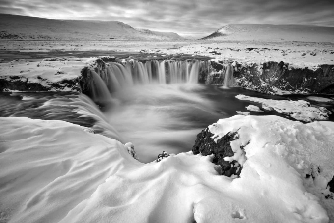 Wall mural of a snowy waterfall FP 5746 - A graphic design featuring water cascading among snow and rocks.