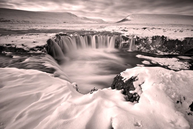Snowy waterfall wall mural FP 5746 - Graphic design. Water cascades over rocks in a snow-covered setting.