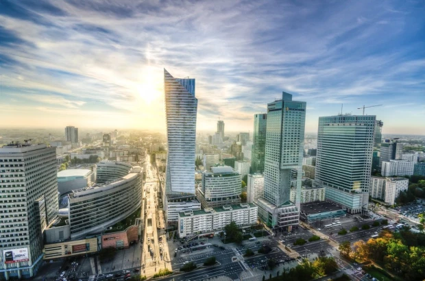 Wall mural of modern skyscrapers in Warsaw FP 5895 - Office decor with gray walls and minimalist furniture.