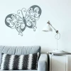 Butterfly wall template 2350 - Living room decor. Light walls, gray furniture, minimalist style.