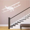 Biplane painting template 2305 - Hallway design with light walls, wooden stairs, and railing.