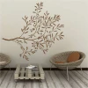Tree branch painting stencil 2379 - Living room decor. Light walls, natural wicker furniture.