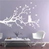 Cat painting stencil on a branch 2382 - Living room setup with purple walls and minimalist furniture.