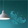 Fiery butterfly painting template 2351 - Styled in a room with dark green wall and hanging lamp.