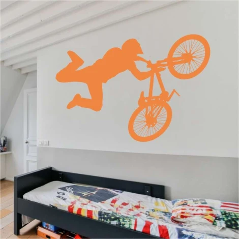 Wall template for bike jumps 2313 - Decor for a child\'s room. Light-colored walls, bed with colorful accents.