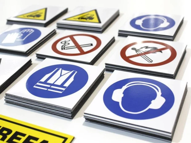 Custom printed magnetic mat - Graphic design featuring various warning and informational symbols on a white background.